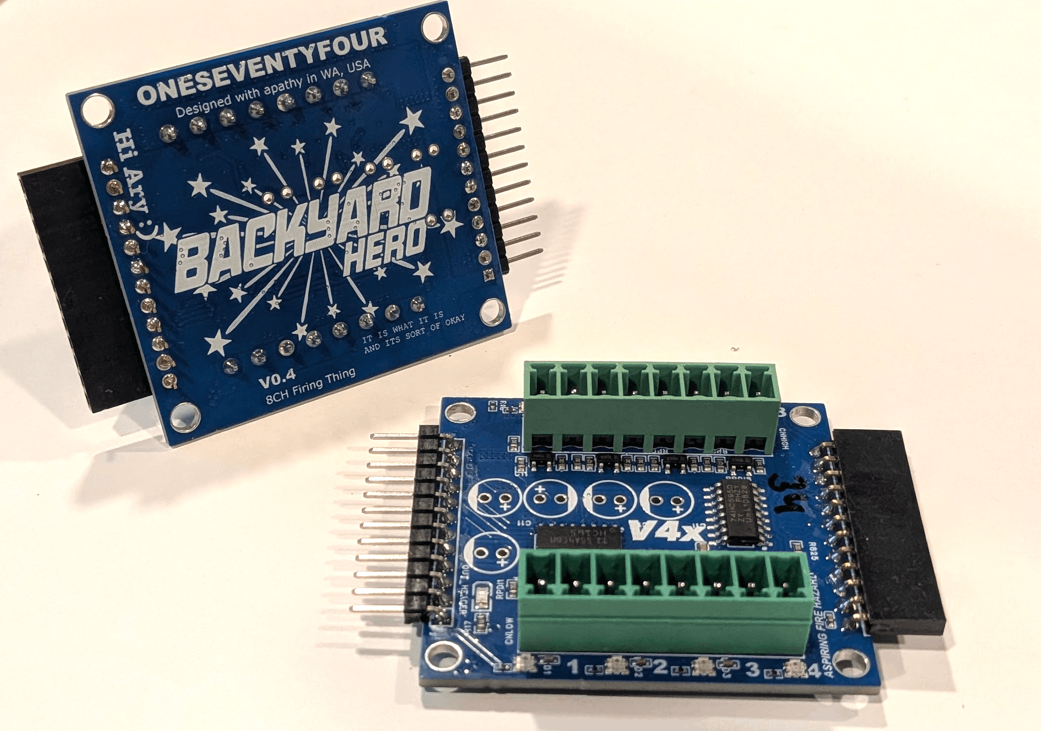 Bare cue-module PCBs showing terminal blocks and trace routing, before assembly