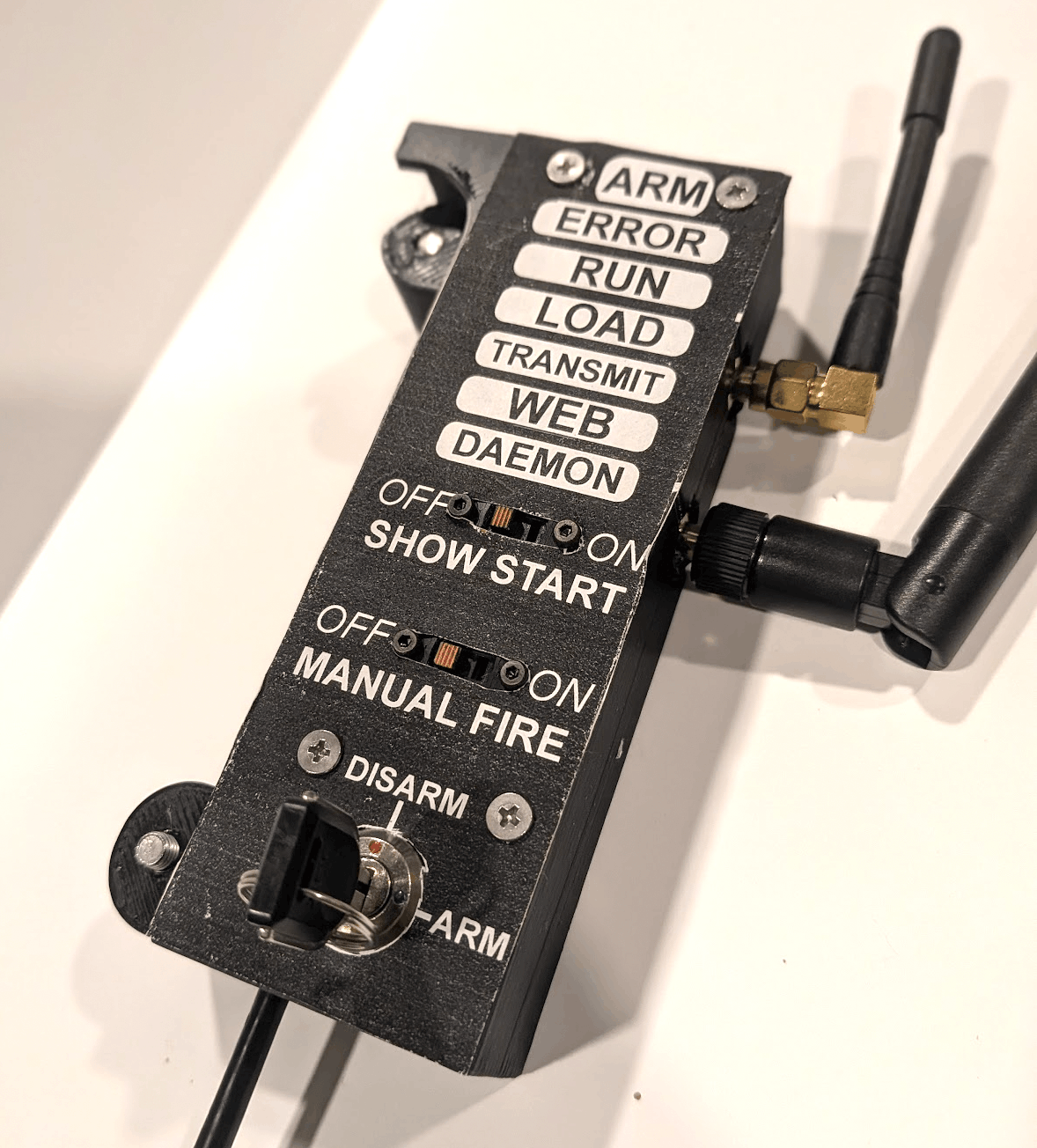 The USB-C dongle, arming switch visible
