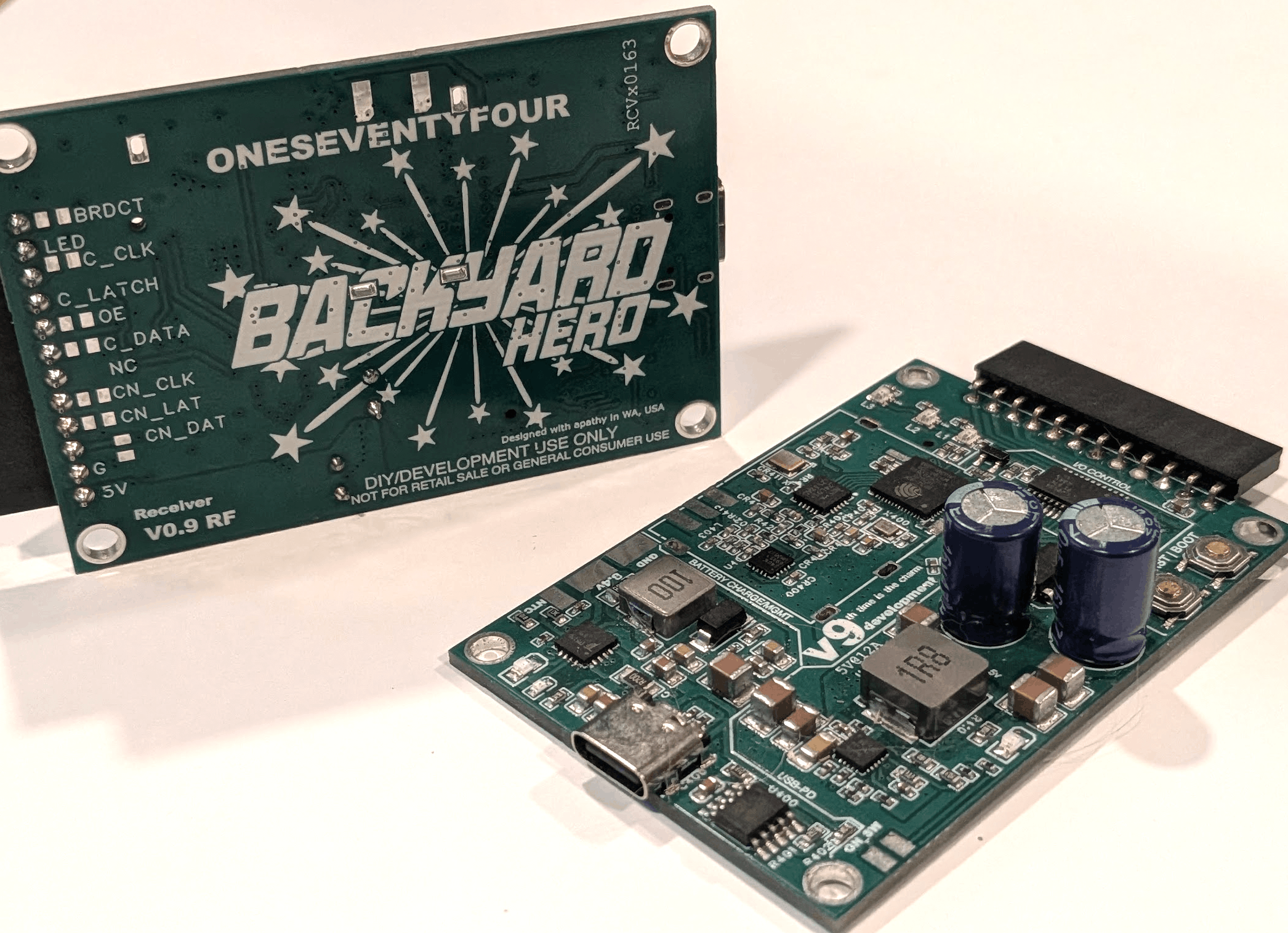 Bare receiver PCB showing the RF frontend, ESP32-S2, USB-C connector and electrolytic caps
